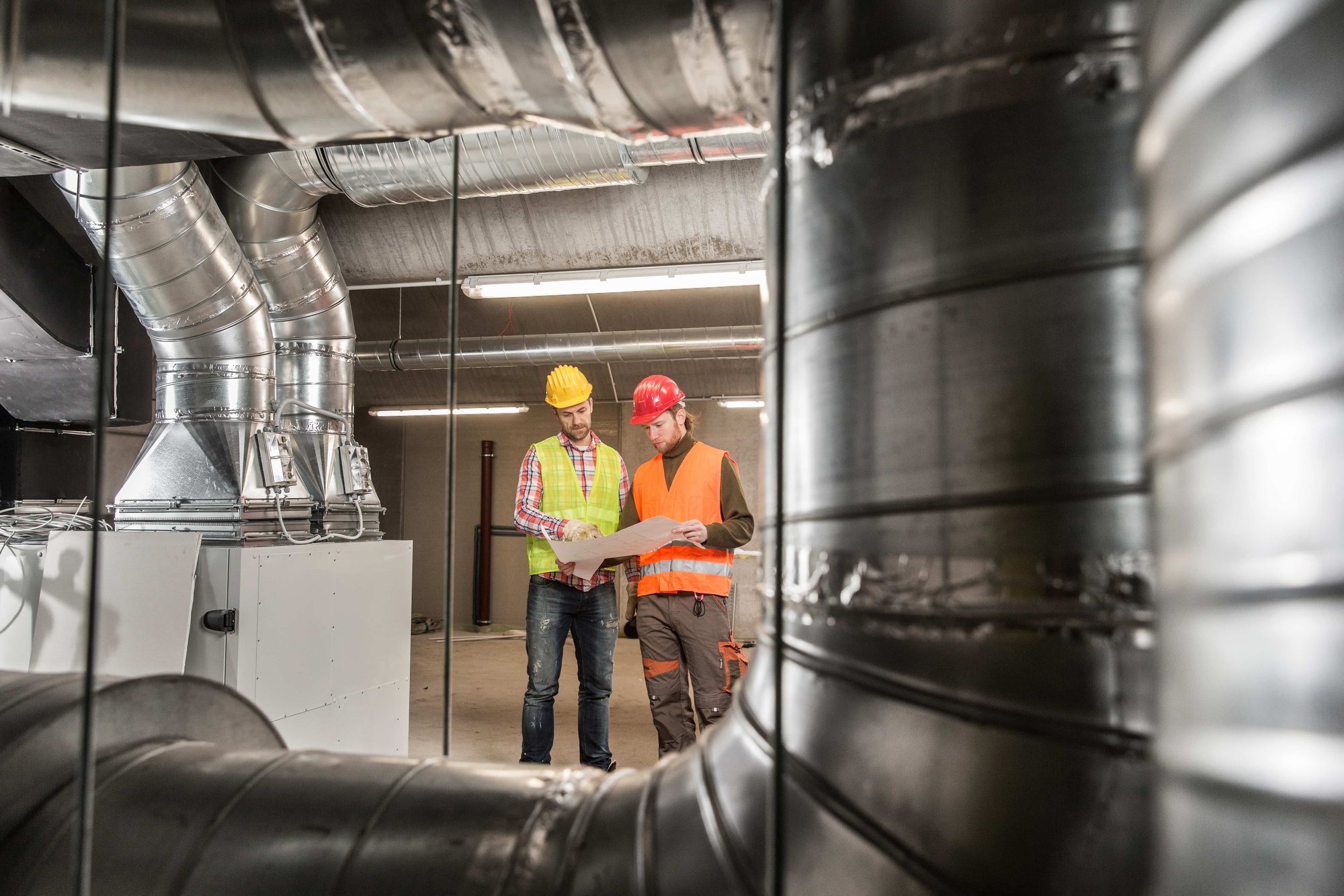 Workers making final touches to HVAC system
